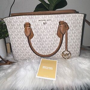Selling tan/white Michael Kors satchel, like new. Very well kept